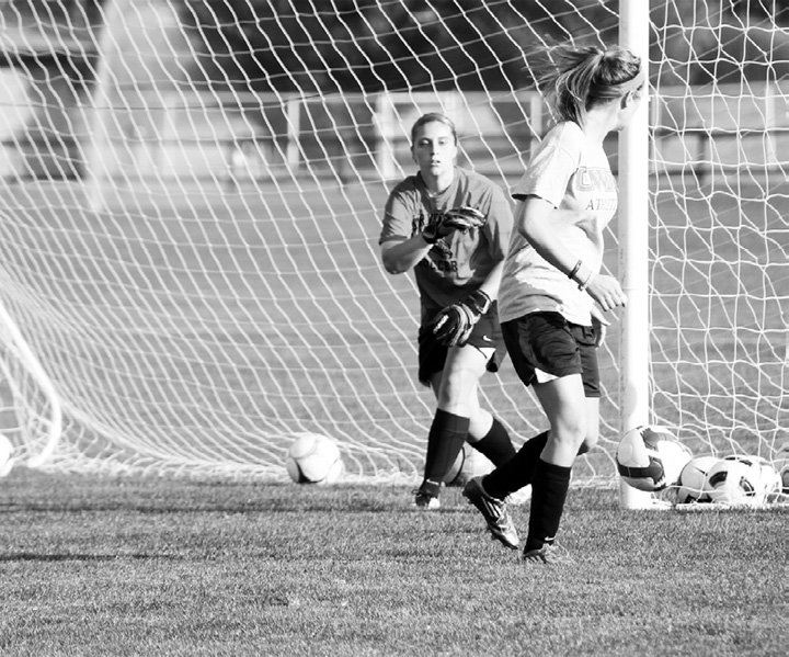 Falcon soccer goalkeeper Becca Kramer (junior) throws the ball to her teammate