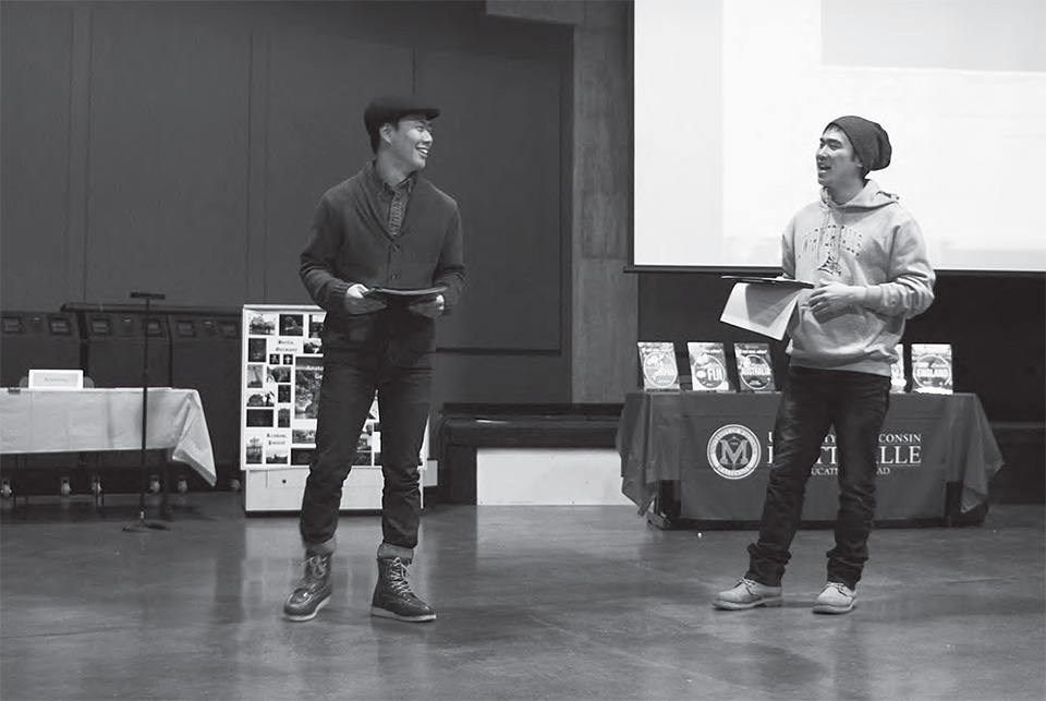 Joomin Hwang and Minchang Jang sing songs in Korean for everyone at the end of the Education Abroad Fair.