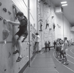UWRF students utilize the indoor climbing wall while participating in the Wellness Challenge.