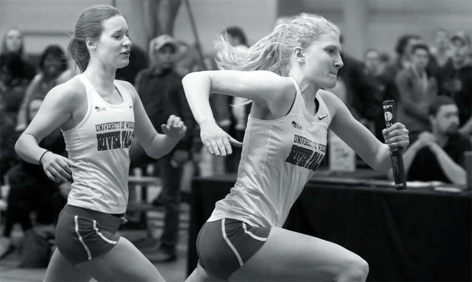 Grace Curran hands the baton off to Jacinta Roggenbuck in the Falcon Winter Classic on Saturday, Jan. 31.