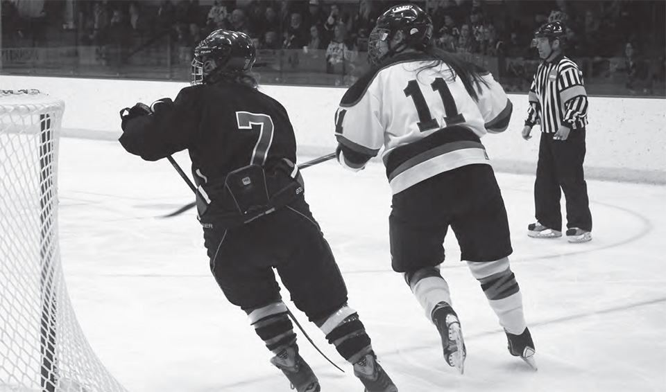 Senior forward Alice Cranston races for a loose puck.