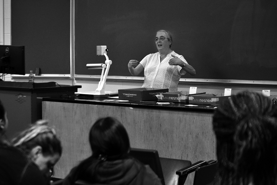 Eileen Korenic gives her astronomy lecture to a crowd of students in Centennial Science Hall's Room 271.