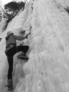 A climber from UWRF ascends an icy cliff face during the Falcon Outdoor Adventures annual ice climbing trip to Sandstone, Minnesota. (Photo courtesy of Falcon Outdoor Adventures)