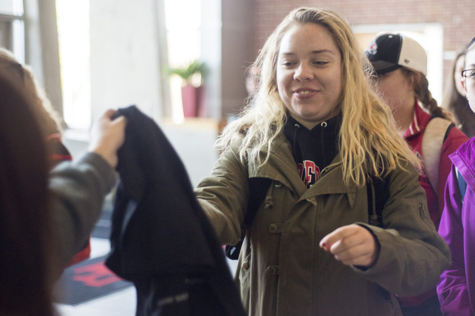 Freshman agricultural marketing communications major Madeline Mielke gets her free It's On Us shirt from a volunteer with the It's On Us campaign in the University Center, Wednesday, Oct. 25. Photo by Tori Schneider/Student Voice