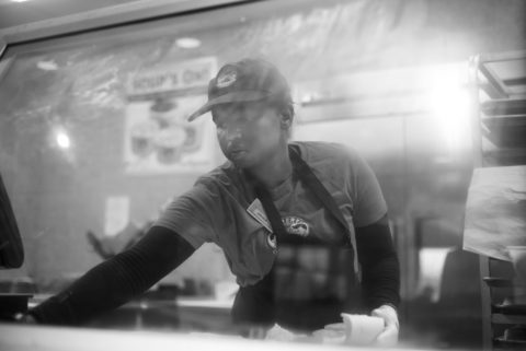 To earn money, Ibrahim works in the University Center at Erbert and Gerbert's, making sub sandwiches.