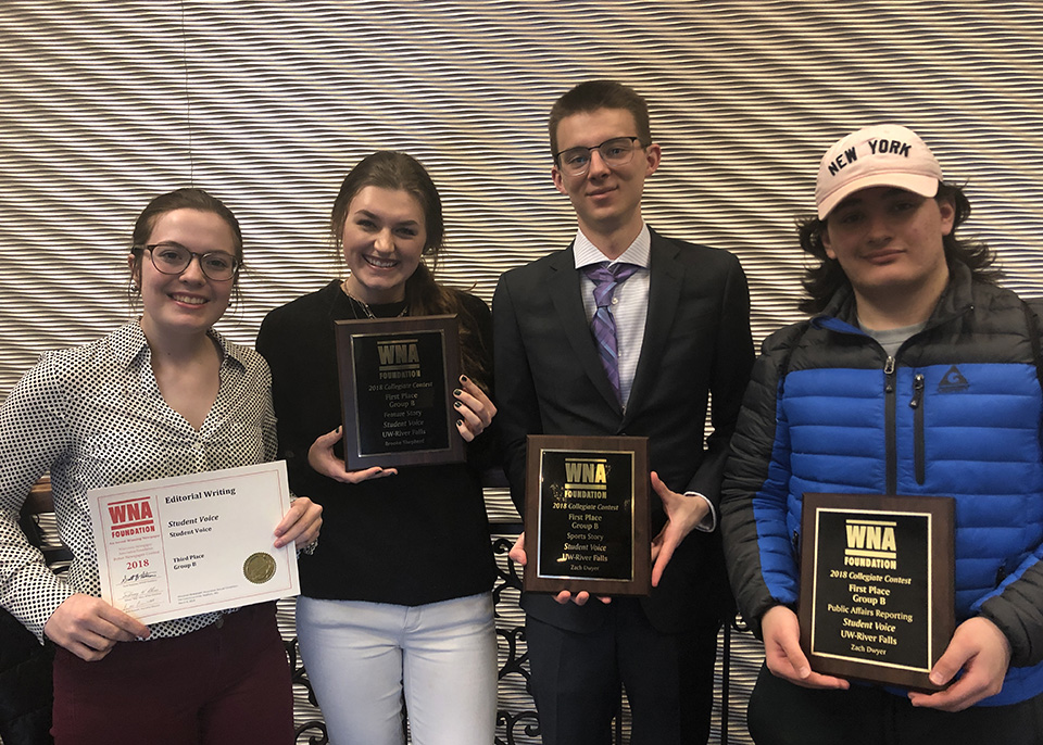 Reporter Kacey Joslin, Editor Brooke Shepherd, Assistant Editor Theodore Tollefson and Reporter Ty Perelman display some of the six awards won by the Student Voice. (Photo by Andris Straumanis)